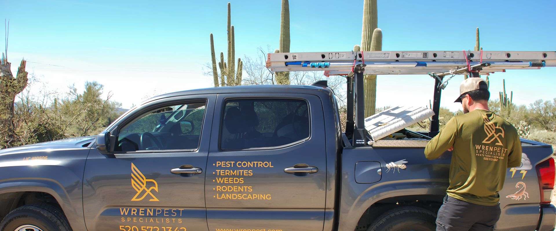 Wren Pest technician equipped for safe bee and wasp removal service in Tucson