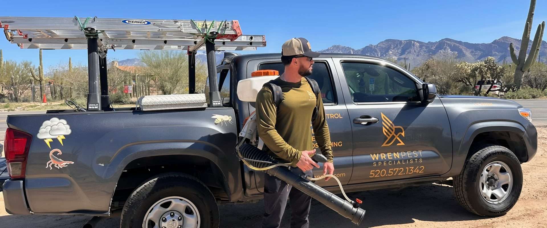 Wren Pest technician with professional treatment equipment ready for pest control in Marana Arizona