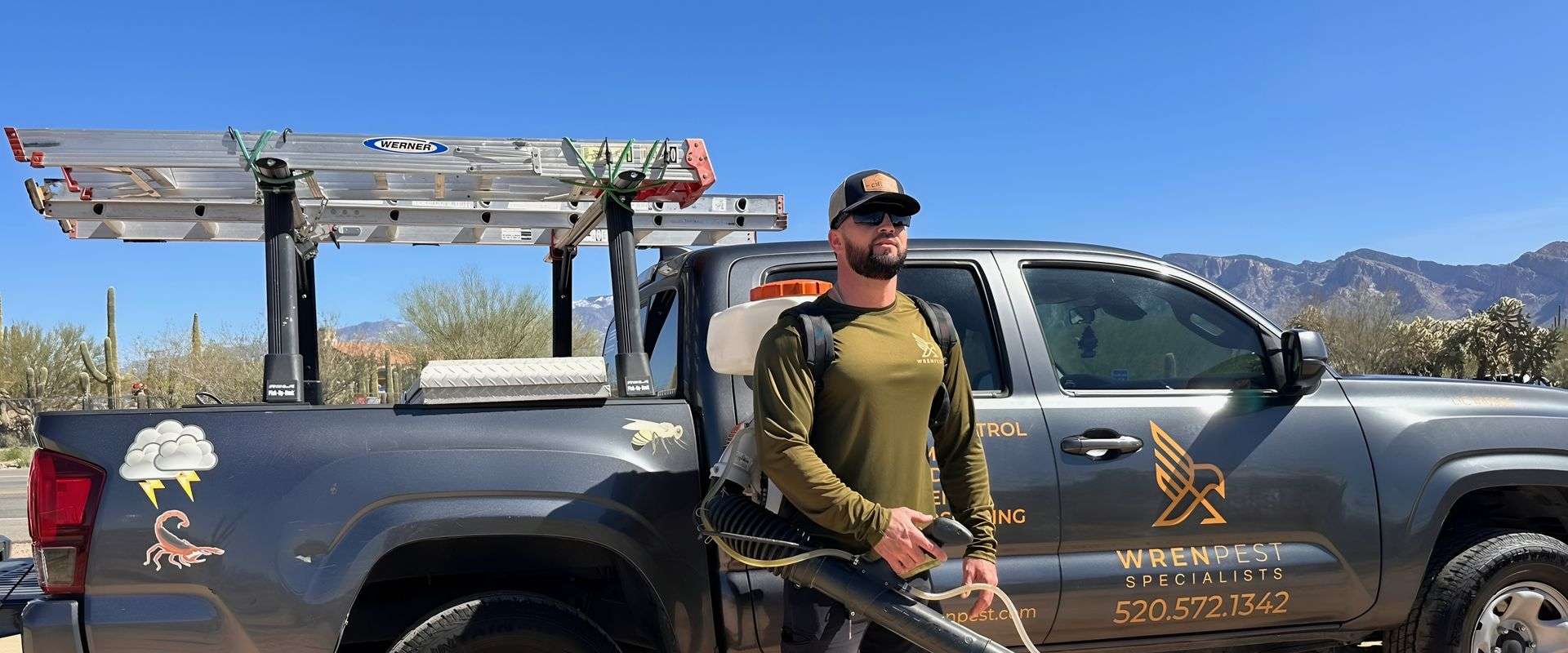 Wren Pest technician geared up and ready for pest control service