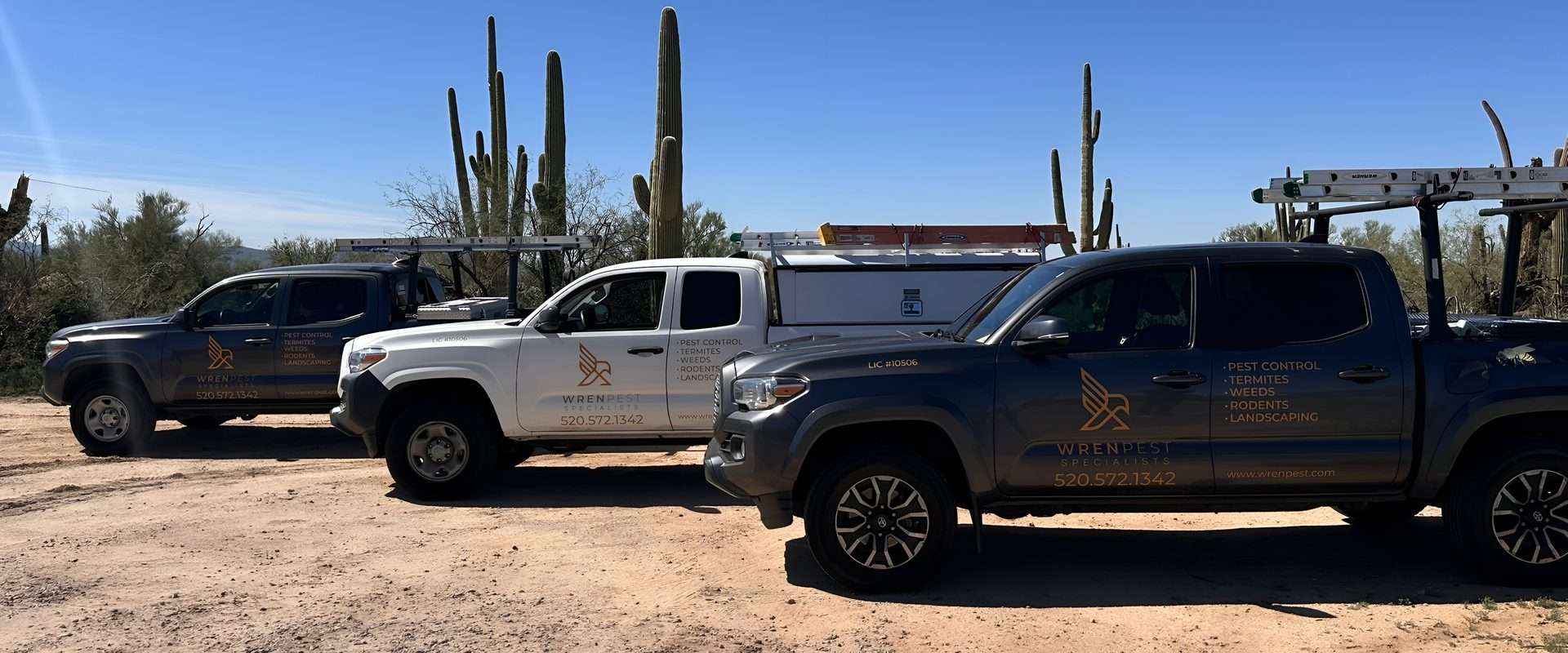 Wren Pest Specialists fleet of branded service trucks serving Tucson