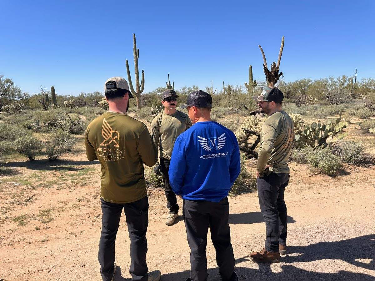 Wren Pest Specialists technicians meeting in the Tucson desert before a day of pest control service calls